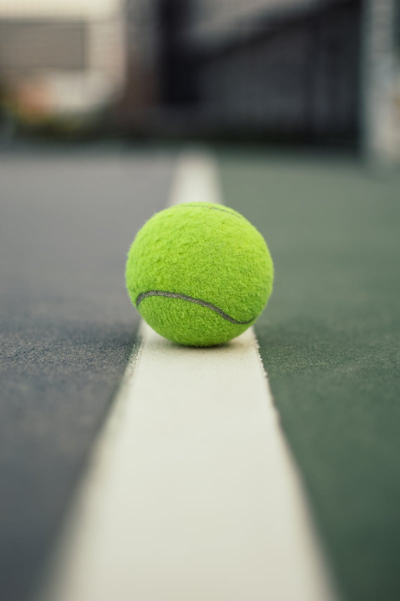 Green Tennis Ball on Court